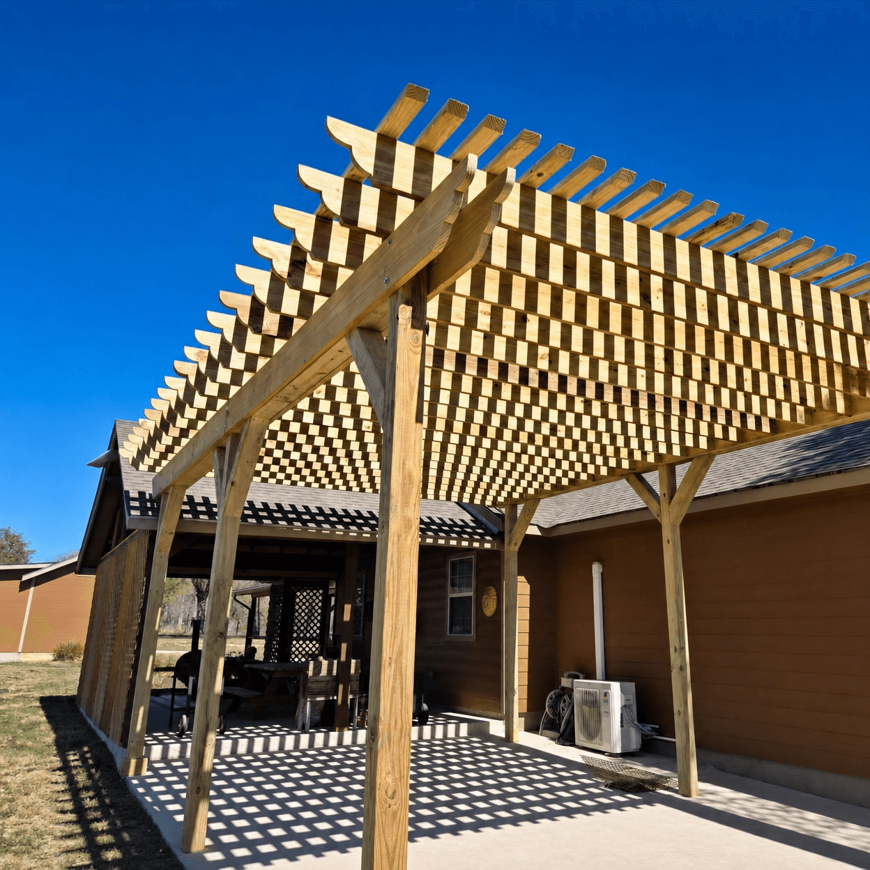 Custom cedar arbor framing a garden entryway